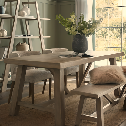 Dining room with wooden table, chairs, and a large window.